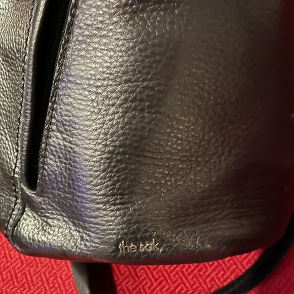 NWOT The Sak Black Leather Sling Backpack - New 5 pocket Leather 1 side canvas. - Picture 10 of 16